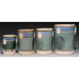FOUR LLANELLY  MOCHA WARE MUGS, 19TH C quart, pint and half pint, sprigged with crowned cartouche,