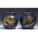 A PAIR OF JAPANESE LACQUERED BLUE AND WHITE PORCELAIN JARS AND COVERS, MEIJI PERIOD with two fan