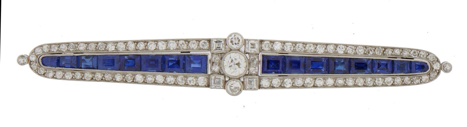 A FINE ART DECO SAPPHIRE AND DIAMOND BROOCH  with larger central old cut diamond in graduated line