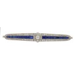 A FINE ART DECO SAPPHIRE AND DIAMOND BROOCH  with larger central old cut diamond in graduated line