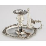 A GEORGE III GADROONED SILVER CHAMBER CANDLESTICK AND EXTINGUISHER   crested, 16.5cm w, fully