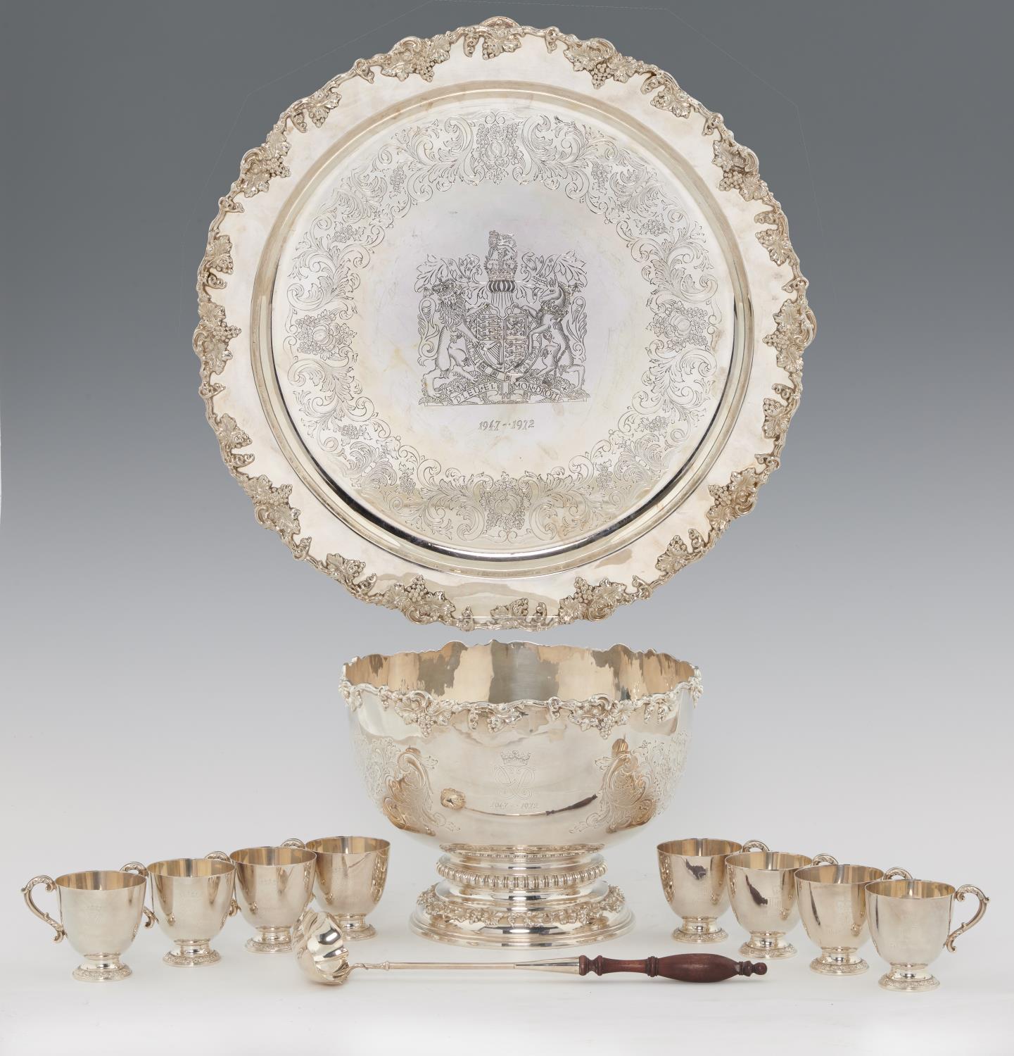 AN ELIZABETH II ROYAL SILVER WEDDING COMMEMORATIVE SILVER PUNCH SET  comprising punch bowl, ladle,