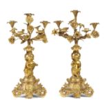 A PAIR OF FRENCH SPELTER GILT CANDELABRA, LATE 19TH C  of five lights above seated putti