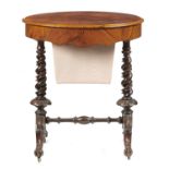 AN OVAL VICTORIAN WALNUT WORK TABLE  with fitted interior, on spiral uprights and scroll carved