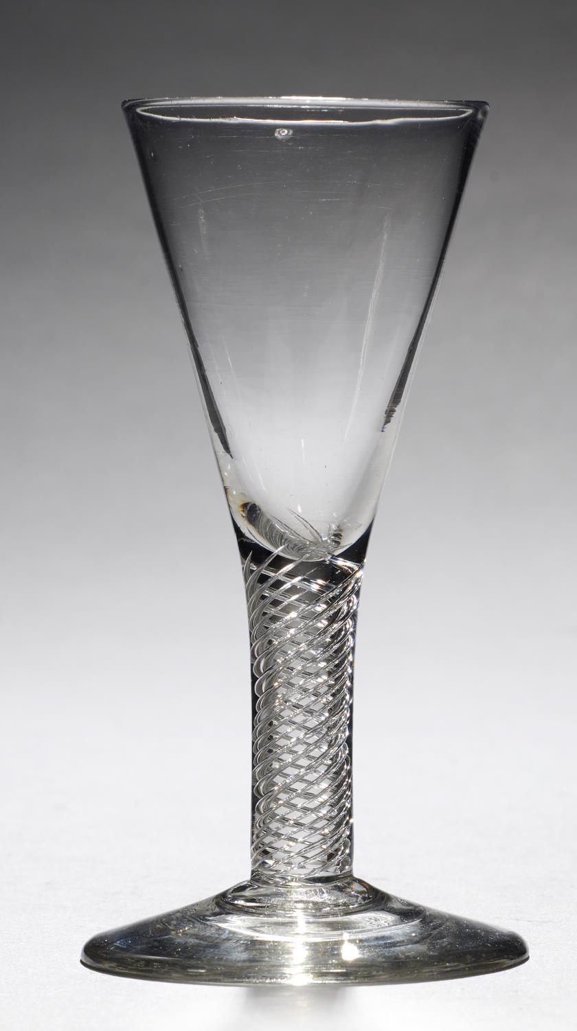 AN ENGLISH WINE GLASS, C1750  the drawn trumpet bowl on multi series air twist stem, conical foot,