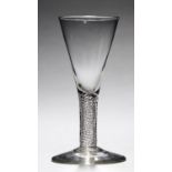 AN ENGLISH WINE GLASS, C1750  the drawn trumpet bowl on multi series air twist stem, conical foot,