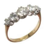 A DIAMOND FIVE STONE RING  with old cut diamonds, gold hoop marked 18c, 2.7g, size N Light wear