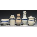 AN UNUSUAL CYLINDRICAL PEARLWARE DRY MUSTARD POT, A MUSTARD POT AND COVER, TWO CASTERS AND A