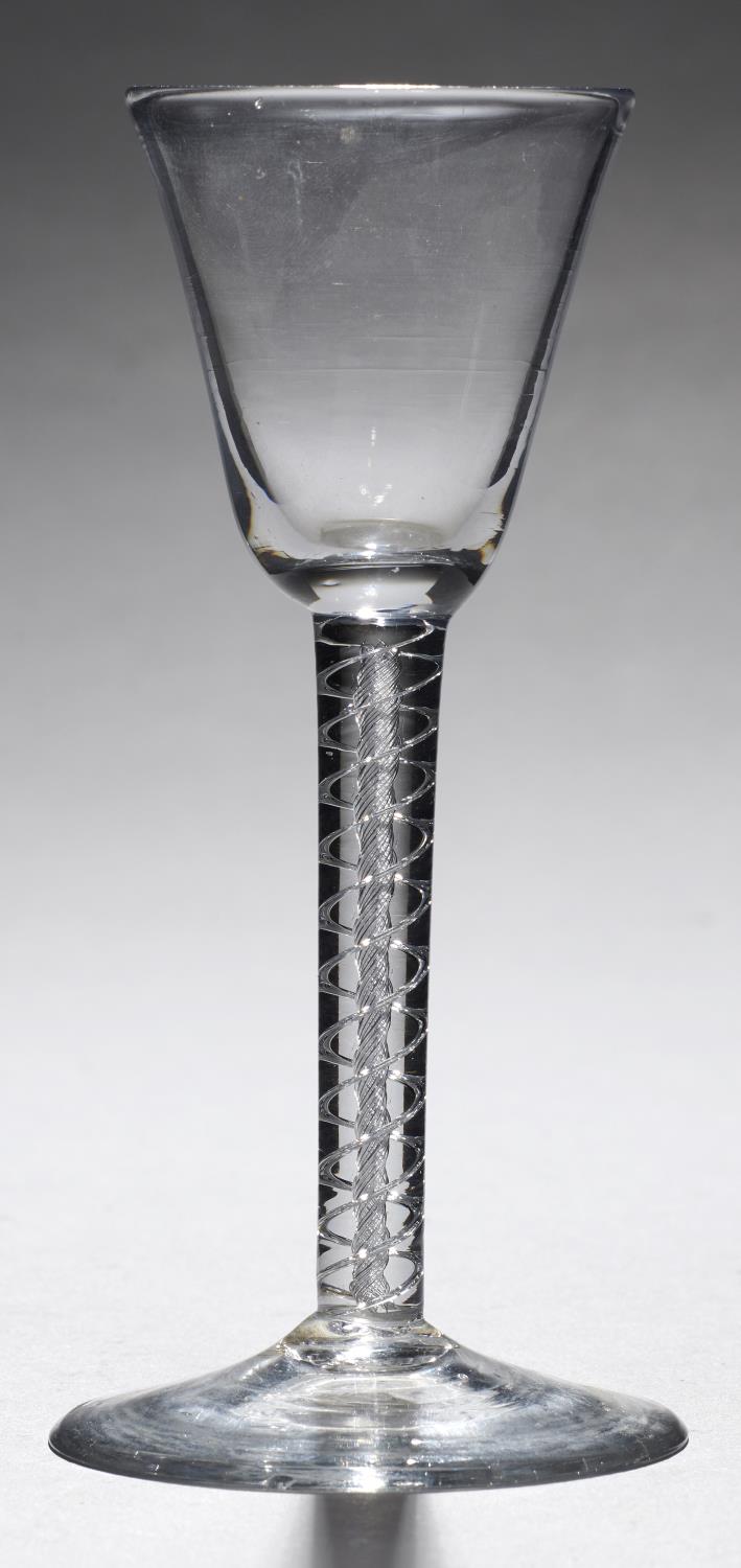 AN ENGLISH WINE GLASS, C1760  the round funnel bowl on double series air twist stem, conical foot,