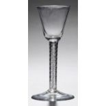 AN ENGLISH WINE GLASS, C1760  the round funnel bowl on double series air twist stem, conical foot,