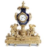 A FRENCH ORMOLU AND SEVRES STYLE GROS BLEU PORCELAIN MOUNTED MANTEL CLOCK, LATE 19TH C  the movement