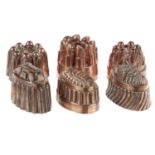 SIX VICTORIAN AND EARLY 20TH C COPPER JELLY MOULDS one engraved with the initials TR, 13cm h Good