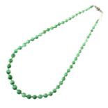 A NECKLACE OF JADE BEADS WITH EMERALD AND DIAMOND CLASP, C1930  in platinum, beads 0.35 - 0.7cm,