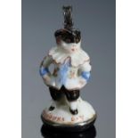 A CHELSEA PORCELAIN TOY, C1756-8  as a man in a carnival mask inscribed in red enamel TOUJOURS