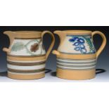 TWO MOCHA WARE CHAMBER JUGS, SECOND HALF 19TH C  of buff earthenware with white slip band of seaweed