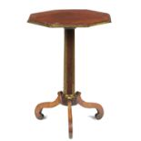 AN OCTAGONAL REGENCY BRASS MOUNTED ROSEWOOD TRIPOD TABLE, EARLY 19TH C  the hollow fluted pillar