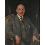 FRANK SLATER (1903-1965) PORTRAIT OF MICHAEL MILLETT  seated half length in a light grey suit,