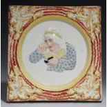 AN UNUSUAL STAFFORDSHIRE PRESS MOULDED CREAMWARE FEMALE SNUFF TAKER PLAQUE, C1830  brightly