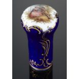 A MEISSEN CANE HANDLE, LATE 19TH C  lightly moulded with gilt scrolls and painted with lovers, 8cm