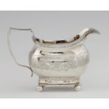 A GEORGE III SILVER CREAM JUG  engraved with a band of birds and vines, 10cm h, maker's mark rubbed,