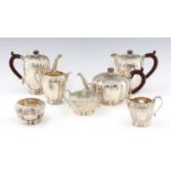 AN ELIZABETH II SEVEN PIECE SILVER TEA AND COFFEE SERVICE  of lobed ovoid form and flat chased