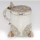 A VICTORIAN SILVER PEG TANKARD  the lid embossed with St Hubertus,  lion thumbpiece and feet, the
