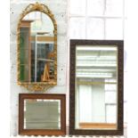 A CARVED OAK MIRROR, 82 X 46CM, A GILTWOOD AND COMPOSITION MIRROR, 75 X 34CM AND ANOTHER