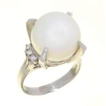 A SOUTH SEA CULTURED PEARL AND DIAMOND RING, THE WHITE PEARL 1.3 CM DIAMETER, IN PLATINUM MARKED