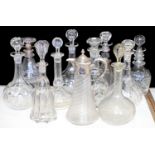 ELEVEN REGENCY AND LATE 19TH C CUT GLASS DECANTERS, VARIOUS STOPPERS AND SIZES