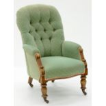 A VICTORIAN WALNUT NURSING CHAIR UPHOLSTERED IN GREEN BUTTON BACK FABRIC