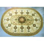 AN OVAL CHINESE STYLE SILK RUG, 350 X 250CM AND TWO OTHERS, SMALLER