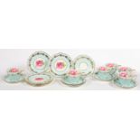 A SET OF SIX AYNSLEY LIGHT BLUE GROUND TEA CUPS, SAUCERS AND SIDE PLATES, DECORATED WITH A ROSE,