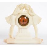 AN ART DECO CARVED ALABASTER MANTEL TIMEPIECE, 23CM H