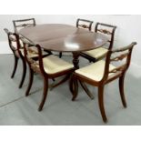 A MAHOGANY EXTENDING DINING TABLE ON TWIN PEDESTAL BASE AND A SET OF SIX CARVED MAHOGANY CHAIRS,