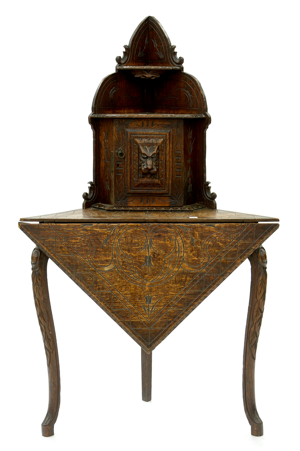 A VICTORIAN CARVED OAK FOLDING CORNER TABLE, MOUNTED WITH A CUPBOARD, 131CM H X 78CM W