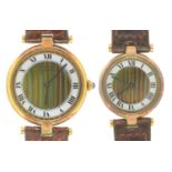 TWO LE MUST DE CARTIER SILVER GILT LADY'S AND GENTLEMAN'S WRISTWATCHES, 2.1 & 2.6CM DIAM, LEATHER