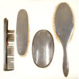 THREE GEORGE V SILVER BRUSHES AND A COMB, BIRMINGHAM 1911, 1917 AND 1918, COMB MARKS RUBBED (4)