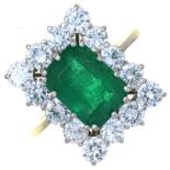 AN EMERALD AND DIAMOND RING, THE STEP CUT EMERALD 3.8CT APPROX, BRILLIANT CUT DIAMONDS 2.5CT APPROX,