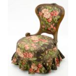 A VICTORIAN CARVED WALNUT NURSING CHAIR