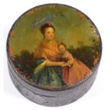 A PAPIER MACHE ROUND BOX AND COVER, THE COVER PAINTED WITH A YOUNG WOMAN AND CHILD IN A LANDSCAPE,