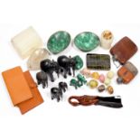 AN ONYX CIGARETTE BOX, A ROCK CRYSTAL ASHTRAY, SEVERAL MALACHITE CARVINGS, TWO PIGSKIN WALLETS,