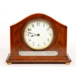 A MAHOGANY MANTEL TIMEPIECE WITH ENAMEL DIAL AND FRENCH MOVEMENT APPLIED WITH TABLET ENGRAVED