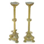 A PAIR OF CONTINENTAL GILTMETAL ALTER CANDLESTICKS, 77CM H