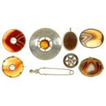 SIX CELTIC BROOCHES INCLUDING CORNELIAN AND AGATE SET IN SILVER, AN AGATE PENDANT IN SILVER AND A