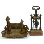 A VICTORIAN CAST IRON FIGURAL DOOR STOP AND A CAST IRON BOOT SCRAPER