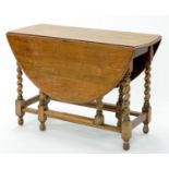 AN OAK GATELEG TABLE ON SPIRAL TURNED LEGS, EARLY 20TH C, 73CM H