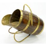 A BRASS BOUND COAL BUCKET IN THE FORM OF A BARREL, EARLY 20TH C