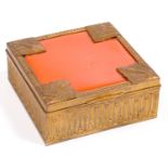 AN ART DECO GILTMETAL AND SEALING WAX RED CELLULOID INSET TRINKET BOX, 9 X 9CM, C1930