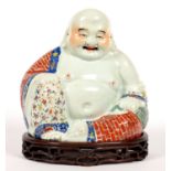 A CHINESE FAMILLE ROSE FIGURE OF BUDAI, 26CM H, OVAL IMPRESSED MARK, 20TH C, WOOD STAND