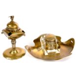 A JUGENDSTIL PIERCED BRASS AND GLASS MOUNTED INKWELL AND AN EASTERN BRASS OIL LAMP WITH DOMED LID